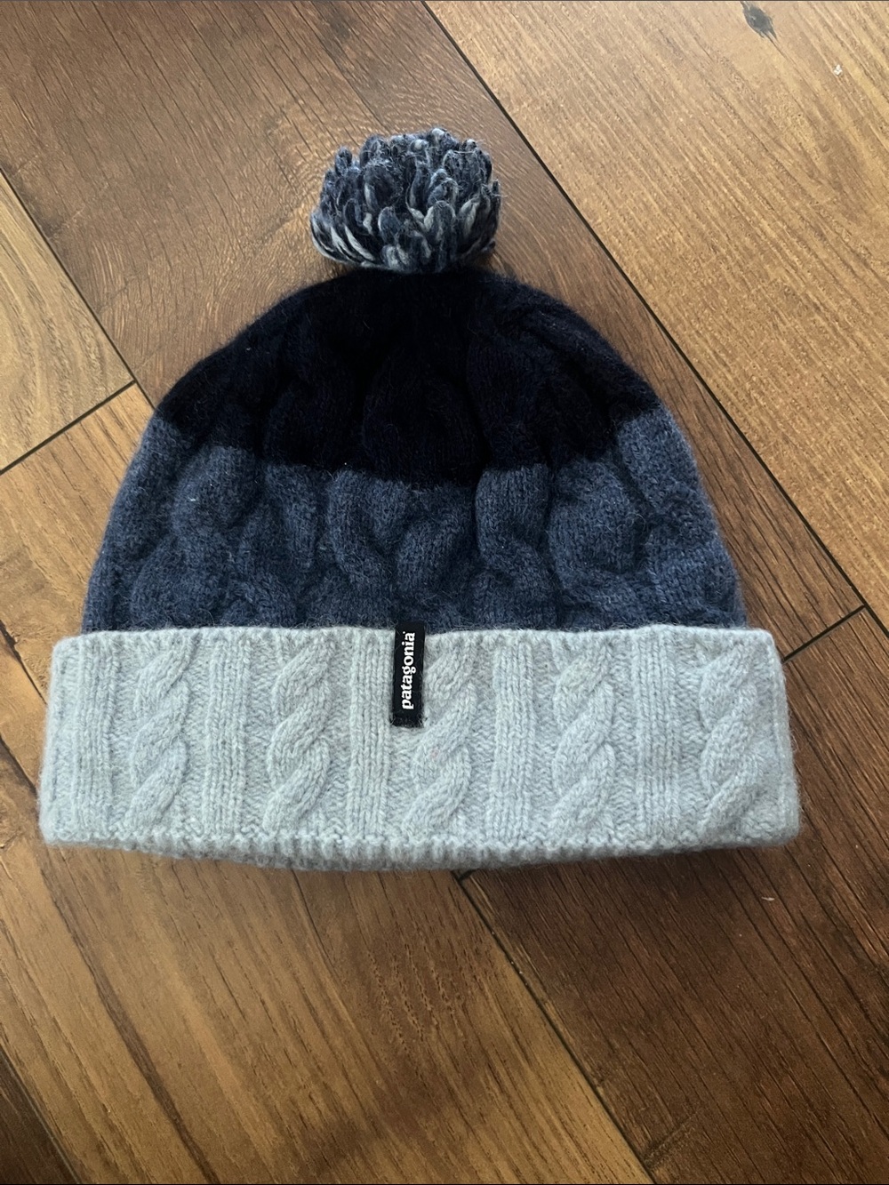 Patagonia Cable-Knit Pom Beanie in Navy and Light Gray 9 1/2" across